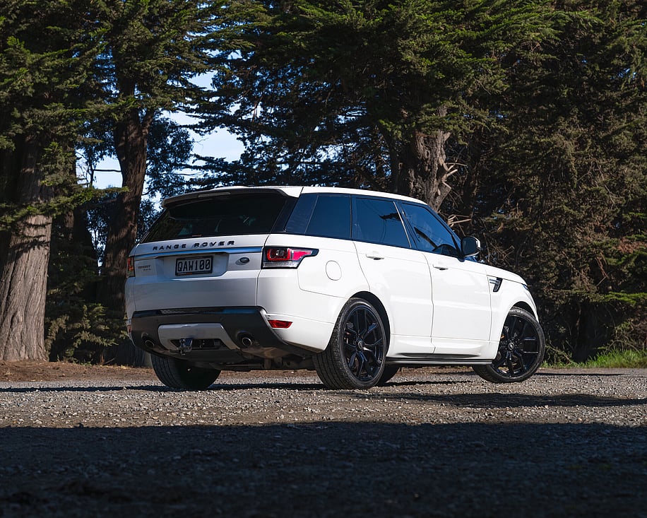 Range Rover Sport rear three quarter view on gravel road