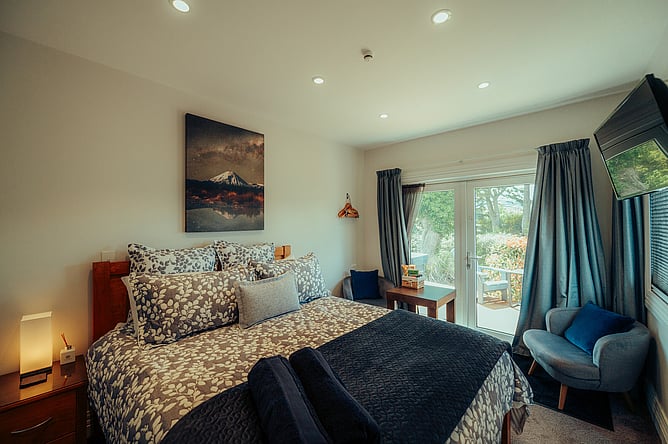The Mangawhero Suite. A private, cosy experience with your own hot tub just outside the doors.
