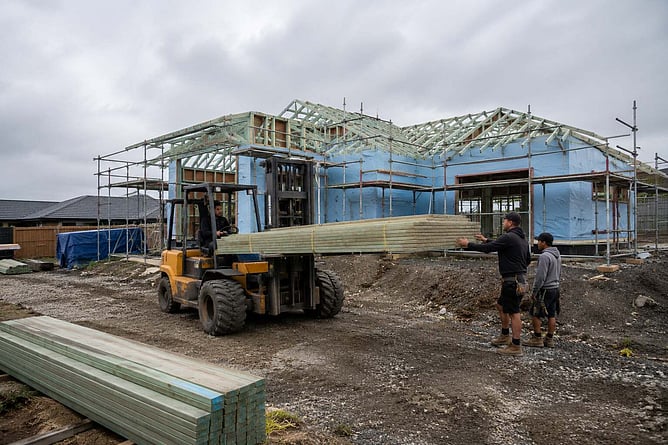 forklift and tradies working on a new home build, ai created