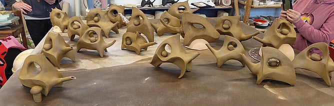A whole herd of teapots &mdash; all riffing off a Rick Rudd design, each one unique, but related. Same lineage, different personalities.