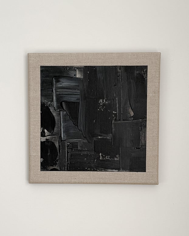 full image of a black and pale cream acrylic abstract painting on linen, showing layered painted rectangular forms, vertical drag marks and impasto passages within an exposed linen border