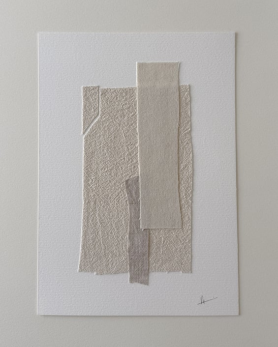 full image of layered collage with pale, beige-toned linen and cotton fragments on ivory fabriano, showing soft frayed edges and handwritten signature in lower right corner 