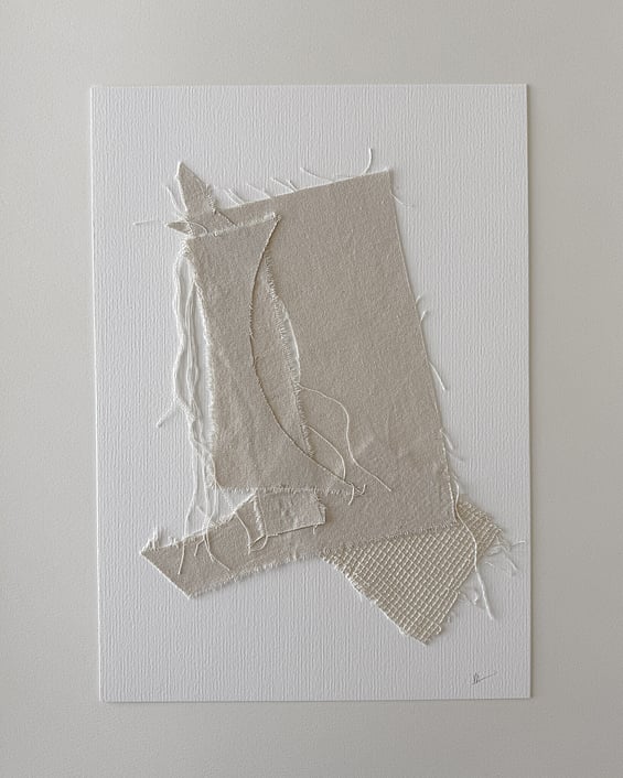 full image of layered collage with soft honey-toned cotton fragments on ivory fabriano, showing frayed edges, hanging threads and handwritten signature in lower right corner 