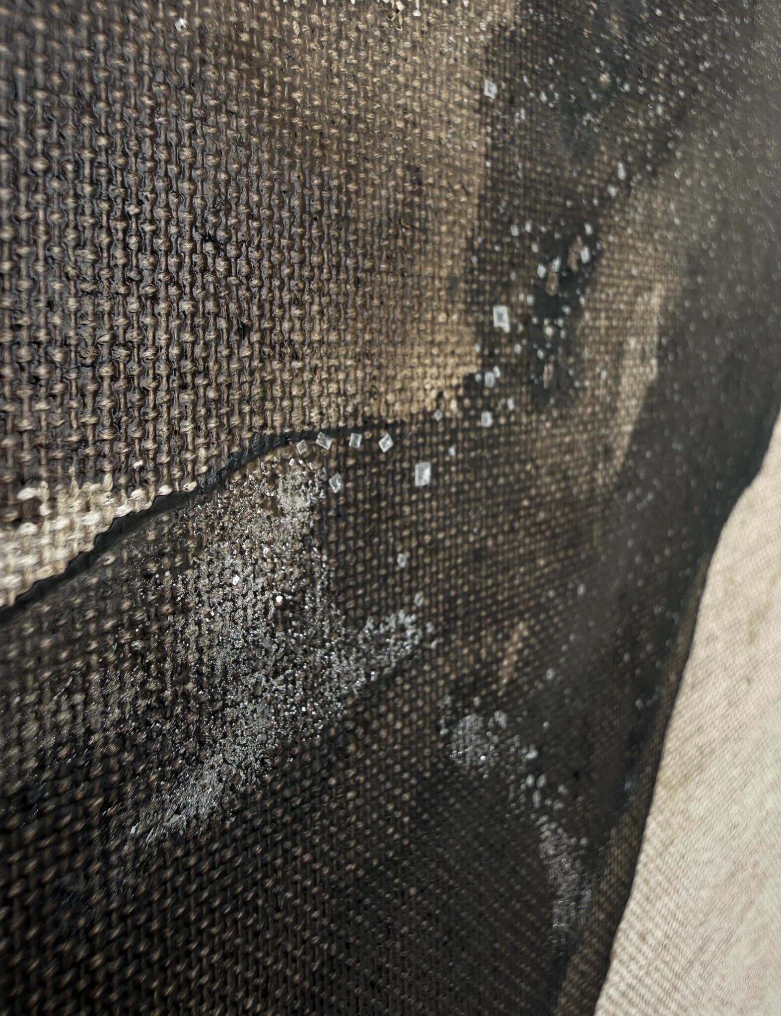 detail image showing deep warm brown tones in layered acrylic ink washes on linen and subtle granular salt texture