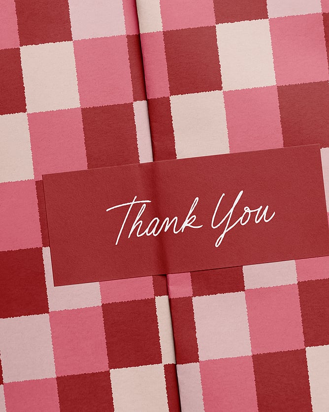Bold vibrant red, pink & cream gingham styled wrapping paper with thank you script sticker. Creative Box. Te Awamutu. New Zealand.