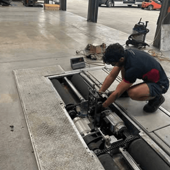 AECS member servicing a brake tester