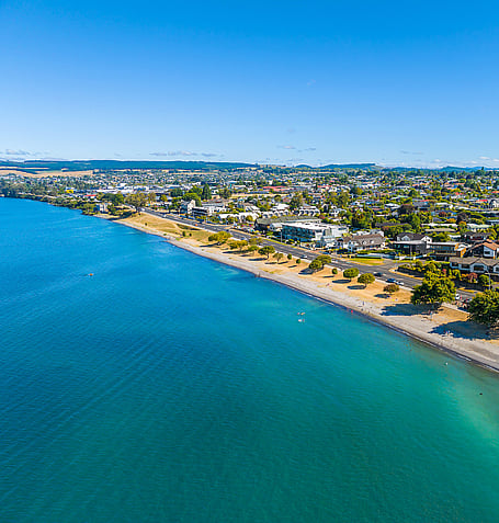 Aerial view of Lake Taupo shoreline and Taupo township