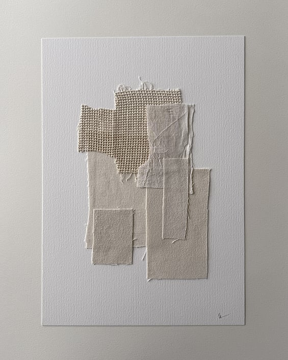 full image of layered collage of tactile sand-toned linen and cotton fragments on ivory fabriano, showing soft frayed edges and handwritten signature in lower right corner
