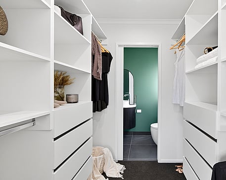 Walk in wardrobe with white cabinetry in Gordonton Road new build by Whitechurch Construction, Te Awamutu builders.