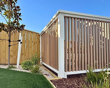 Building timber retaining wall foundation during excavation in Nelson