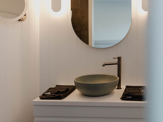 Ensuite bathroom with stone basin and freestanding tap