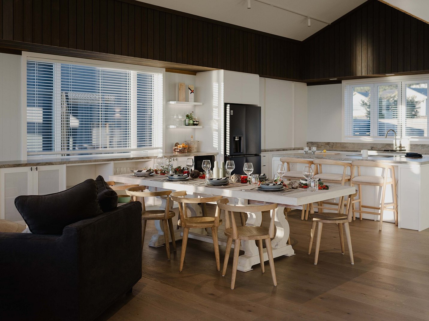 Kitchen and dining area with dark timber bulkhead