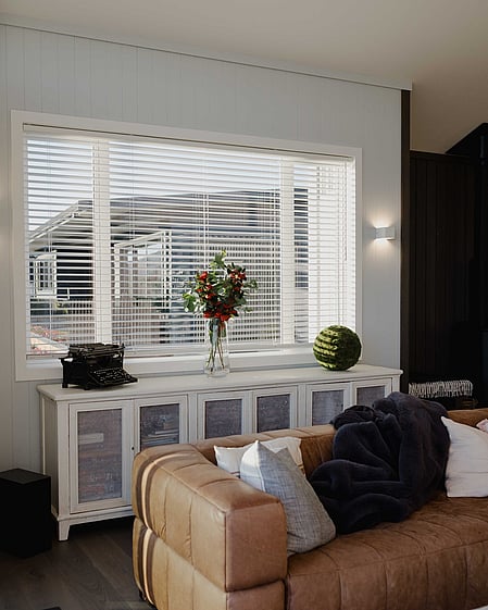 Living area with console and timber blinds
