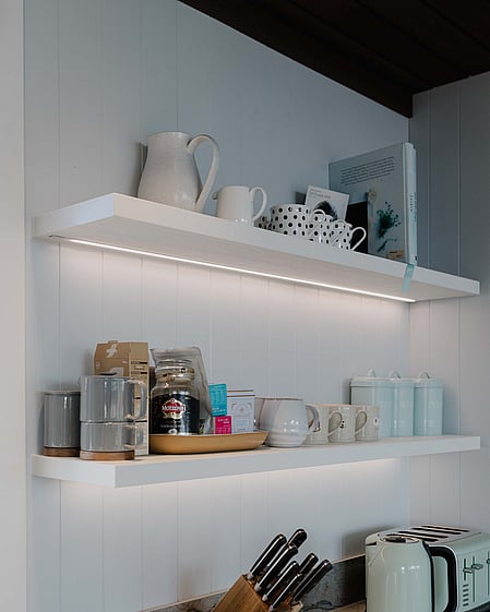 Floating shelves in the kitchen with LED lighting