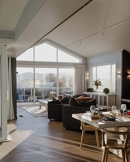 Living area with full height glass and views to Lake Taupo