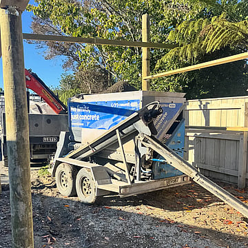 Crewmix CM1000 pouring concrete into post holes