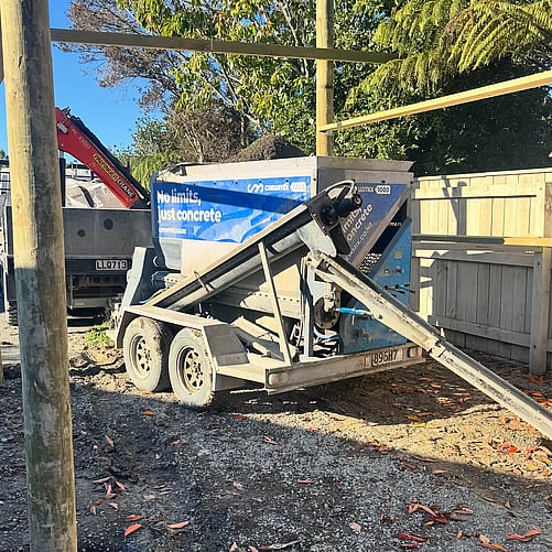 Crewmix CM1000 pouring concrete into post holes