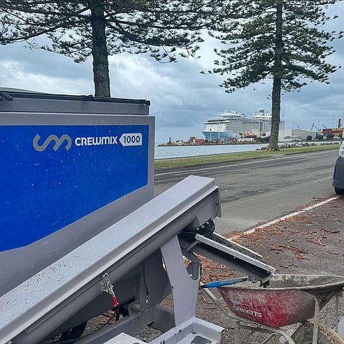 Crewmix CM1000 pouring concrete into wheel barrow