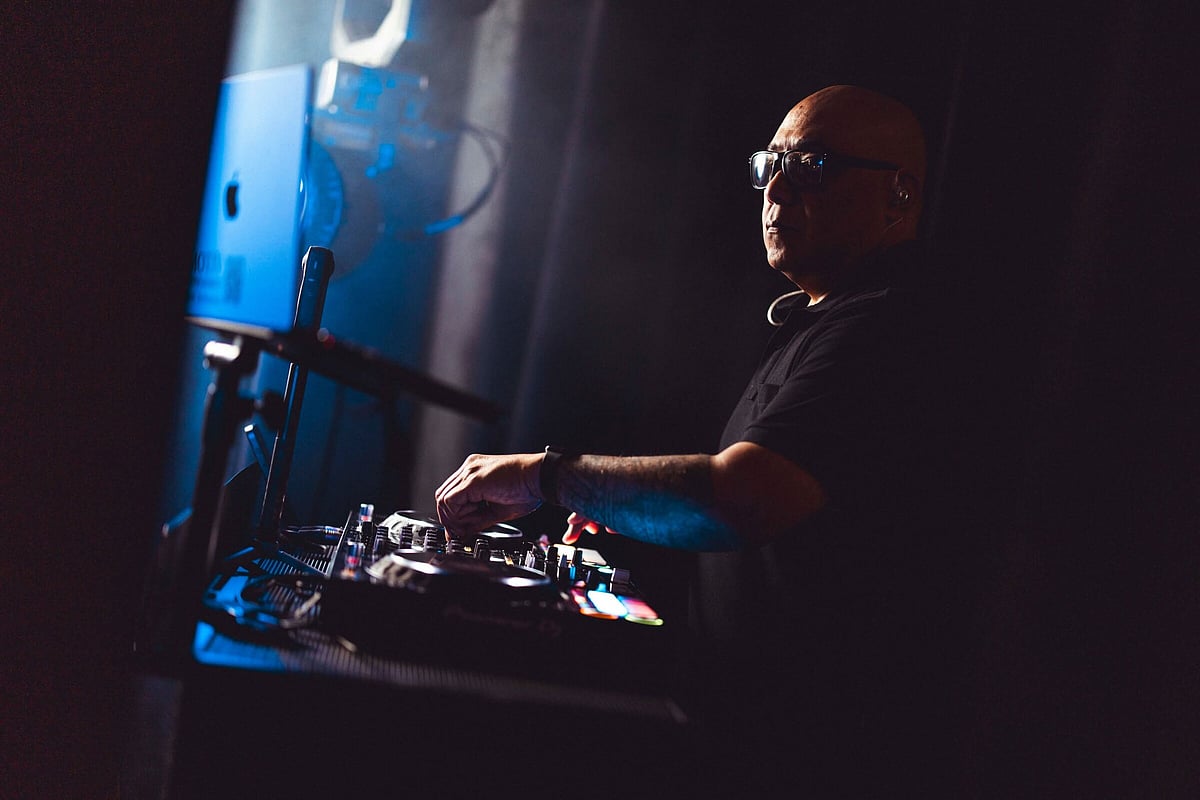 Vito DJing at a wedding in Christchurch, mixing on DJ decks