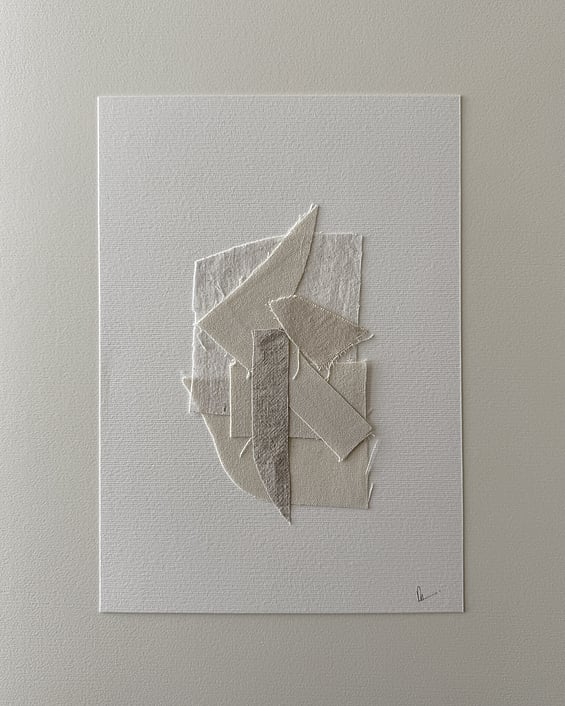 full image of layered collage of wheat-toned linen and cotton fragments on ivory fabriano, showing soft frayed edges and handwritten signature in lower right corner 