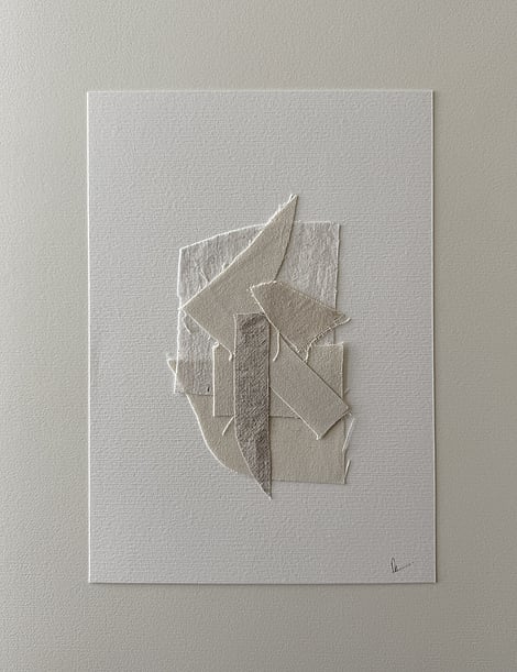 full image of layered collage of wheat-toned linen and cotton fragments on ivory fabriano, showing soft frayed edges and handwritten signature in lower right corner 