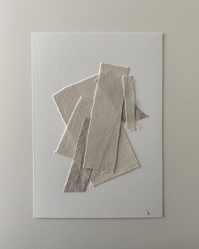 full image of a layered collage of neutral-toned linen and cotton fragments on soft white fabriano, showing soft frayed edges, varied weave textures and handwritten signature in lower right corner