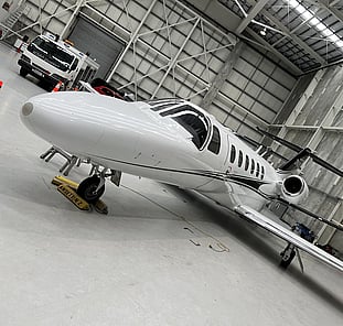 Aircraft ready for detailing inside hangar