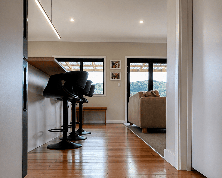 Image of white weatherboard home with new outside decking. Renovated by Coull Builders. Otorohanga, Waikato.