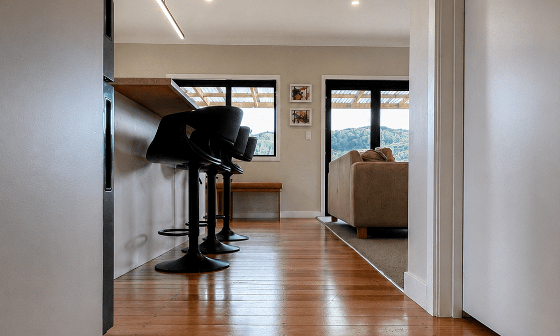 Image of light airy recently renovated kitchen in a weatherboard home. Renovated by Coull Builders, Otorohanga.