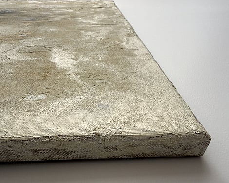 side view of canvas showing granular mineral surface, raised texture and canvas depth
