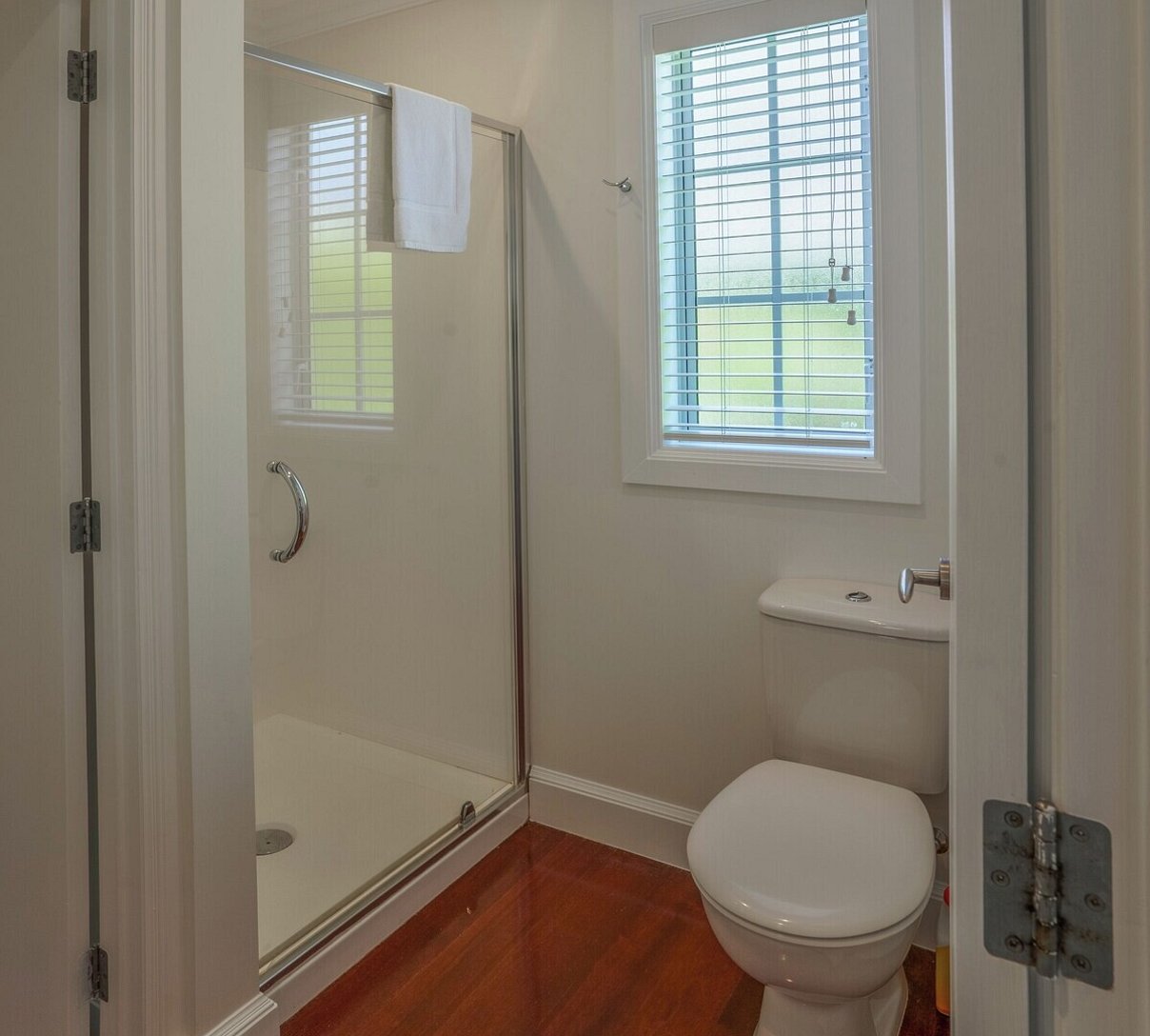 Modern ground floor bathroom conveniently located next to the master king bedroom at Crab Shack Cottage Russell Cottages