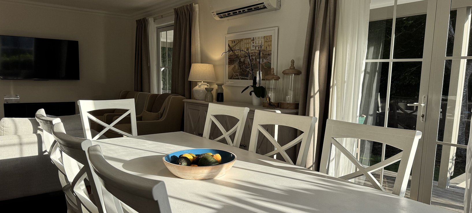 Spacious indoor dining table set for 8 guests at Crab Shack Cottage rental accommodation Russell