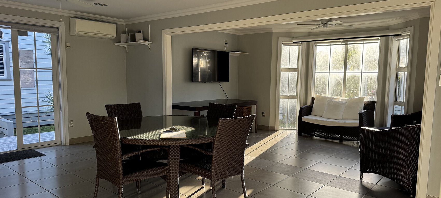 hared pool house social space with ice maker and dual BBQs for guest use