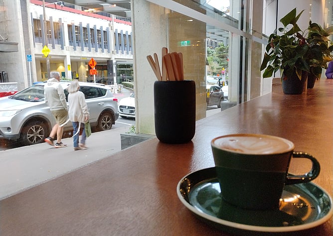 Looking out the window of a cafe to a Wellington streetscape in New Zealand