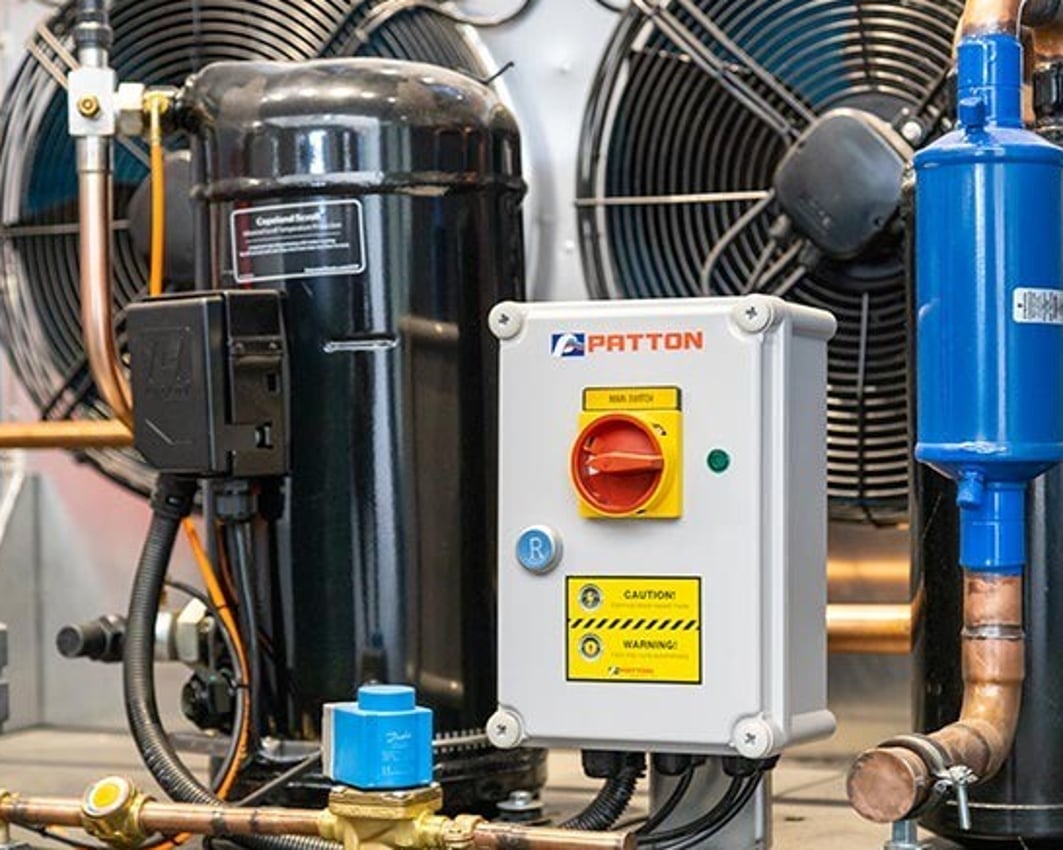 Patton refrigeration compressor unit for a milk cooling system