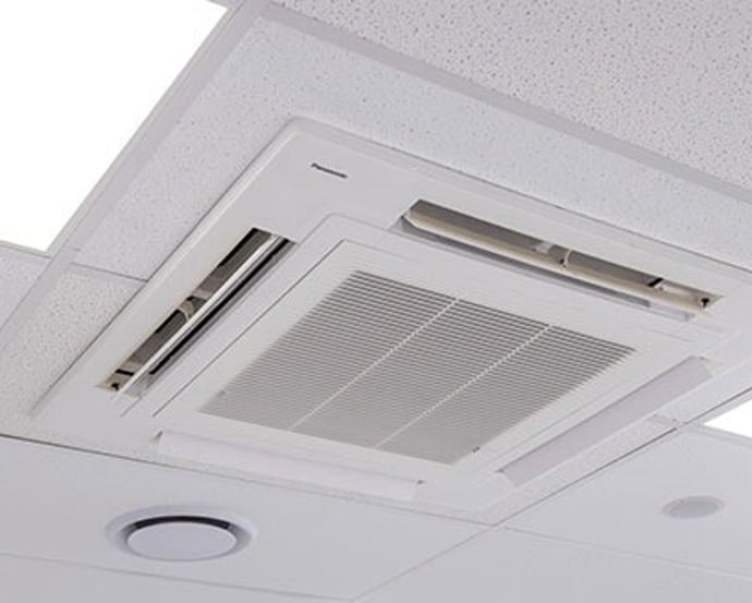 Ceiling cassette air conditioning unit in a commercial space