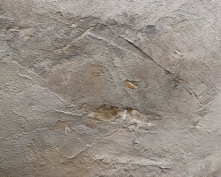 detail image showing raised ridges, pockets of exposed linen, sedimentary texture and softly blended muted smoky earth tones