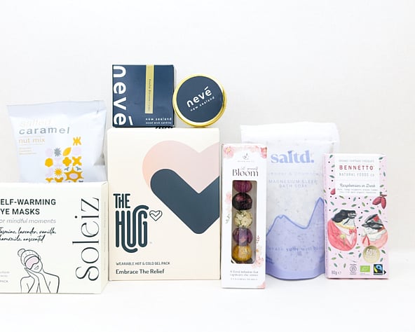 KYND Care Package Gift Box — NZ comfort gift box with HUG hot and cold gel pack, Nevé candle, bath soak, eye masks, Better Tea blooming tea balls and Bennetto chocolate in signature white premium gift box