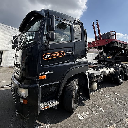 TDM Transport staff member moving modular homes in Hamilton, New Zealand