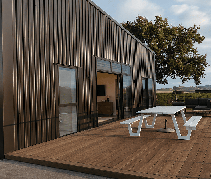 Image of dark exterior cladded new build home with Waikato rural outlooks. Built by Otorohanga builders, Coull Builders.