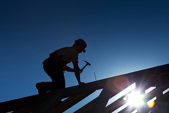 roofer working on a new build roof