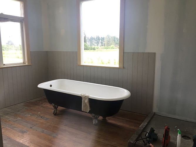 bath in old bathroom being renovated