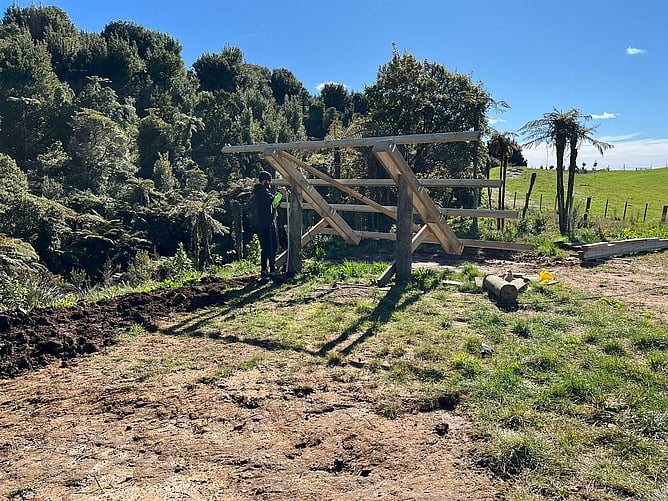Custom timber ground-mount frame being constructed for solar panels, Whakamārama