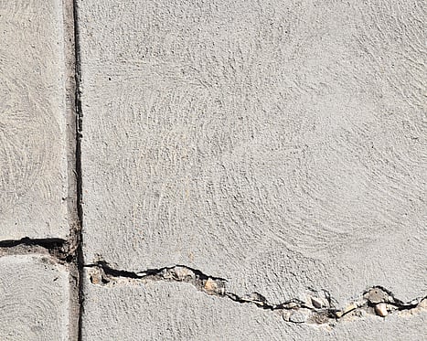 Representative image of cracked concrete requiring remediation and repair