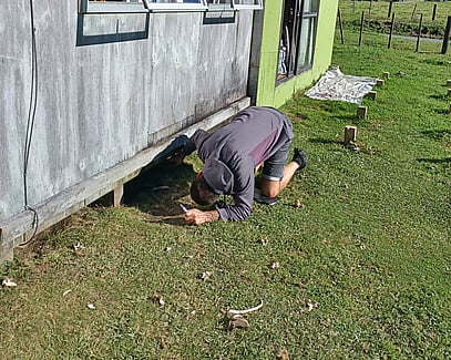 Our home assessors check under homes - looking for insulation and leaks