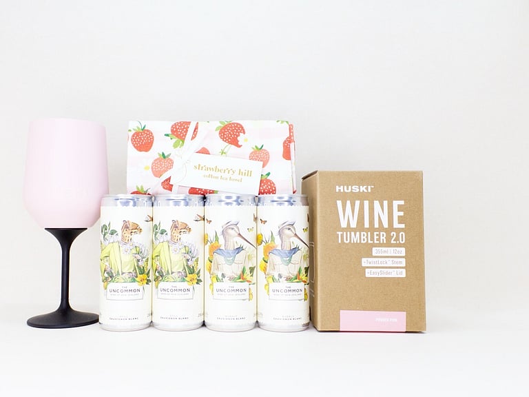 Pretty Wine gift box NZ — premium NZ-made gifts including Uncommon wine cans, Huski wine tumbler and Strawberry Hill tea towel