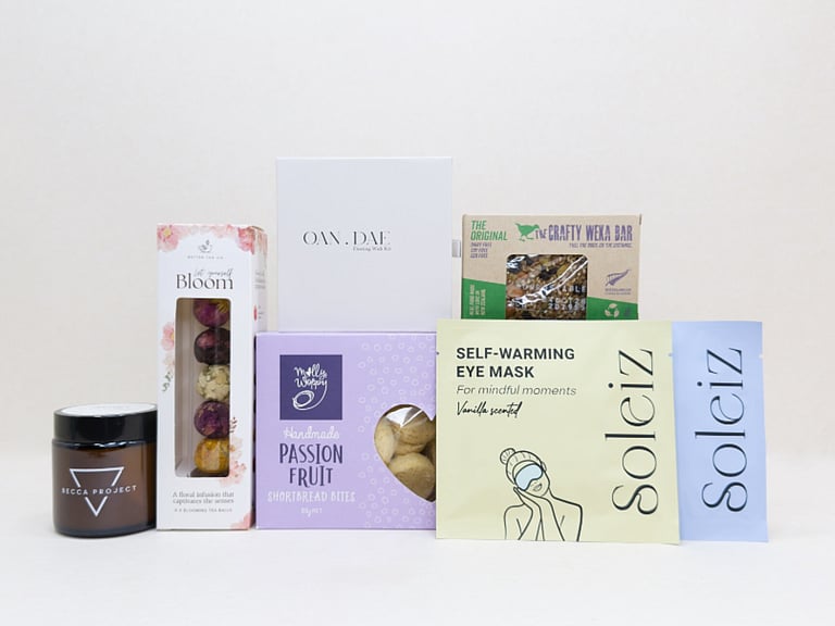 Mindful Moment self-care gift box with Soleiz eye masks, herbal tea balls, OAN DAE wish kit, Molly Woppy cookies, wellness products, and wholesome treats, designed to encourage rest, mindfulness, and everyday self-care