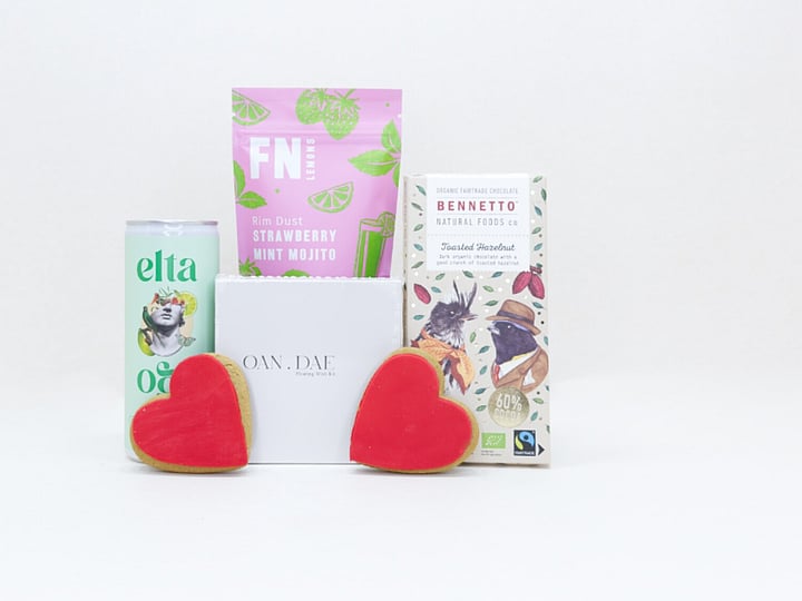 A Gentle Wish gift box with an OAN DAE wish paper kit, Elta Ego self-care products, FN dried lemons, and Bennetto chocolate, thoughtfully packaged as a gift of comfort, encouragement, and support