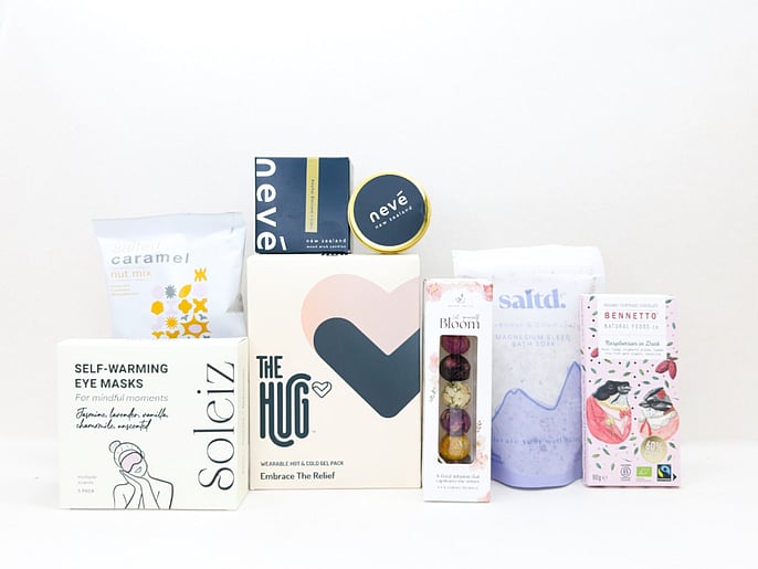 KYND Care Package Gift Box &mdash; NZ comfort gift box with HUG hot and cold gel pack, Nev&eacute; candle, bath soak, eye masks, Better Tea blooming tea balls and Bennetto chocolate in signature white premium gift box