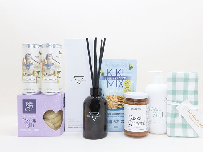 Home Treat gift box NZ — Becca Project candle, Uncommon wine cans, Pepper & Me relish, Kikki crackers and Eddie & Lu hand and body wash
